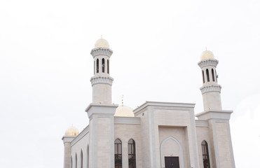 Muslim mosque, white mosque, mosque on a heavenly background.