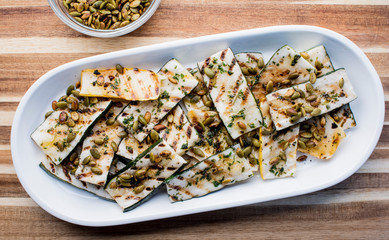 Grilled vegetables. Farm fresh organic veggies, squash, zucchini, red bell peppers, purple onions grilled with olive oil and seasoned with salt and pepper, a classic restaurant favorite side dish