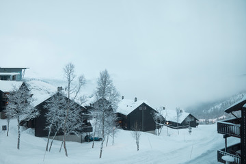 cabins on cold winter mountain