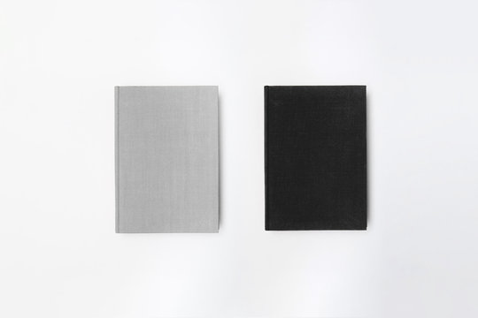 Blank white and black Hardcover Books Mock-Up isolated on white background.High resolution photo.