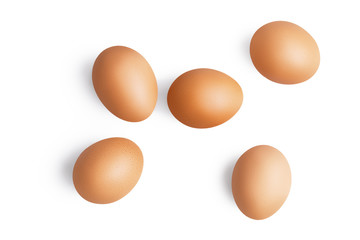 Top view of five brown chicken eggs isolated on white background with shadow