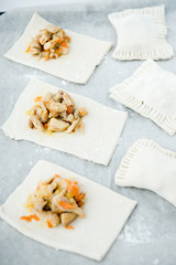 Raw dough with filling. Chicken pie. Dough preparation. Cooking process 