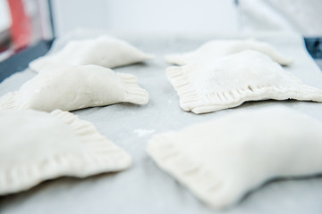 Raw dough with filling. Chicken pie. Dough preparation. Cooking process 
