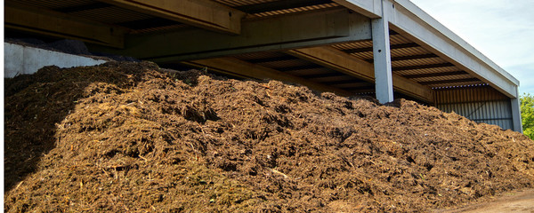 Compost and composted soil as a composting pile. composted soil pile at the compost plant. turning...