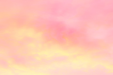 Abstract colorful blurred background, soft pink and yellow sunset clouds