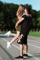 The girl jumped to the guy in her arms