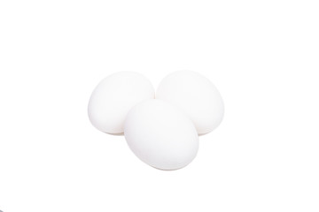 Three white eggs isolated on a white background
