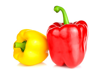 Two bell peppers: red and yellow, isolated on a white background. Close up