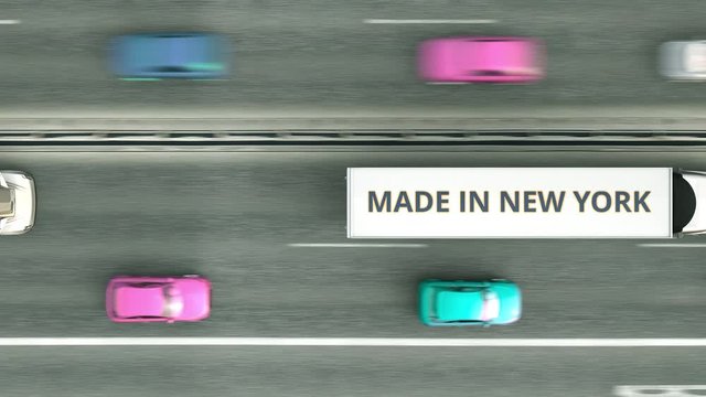 Aerial top down view of semi-trailer trucks with MADE IN NEW YORK text driving along the road. business related loopable 3D animation