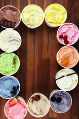 Various of ice cream flavor whit fresh blueberry, strawberry, kiwi, lemon, vanilla setup on rustic background . Summer and Sweet cold ice cream