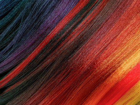 A diverse bright palette of shades of hair dyes in a beauty salon.
