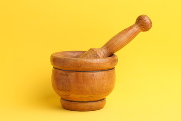 cooking wooden mortar in color background