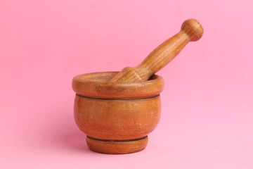 cooking wooden mortar in color background