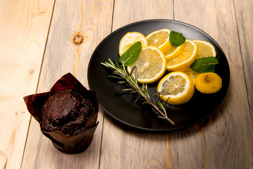  plate with mint rosemary a lemon and cake