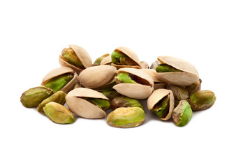 Pistachio nuts. Many pistachios on white.