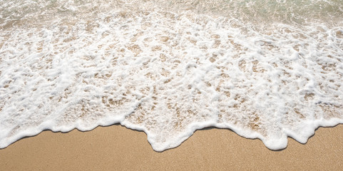 wave of blue ocean on sandy beach. texture Background.