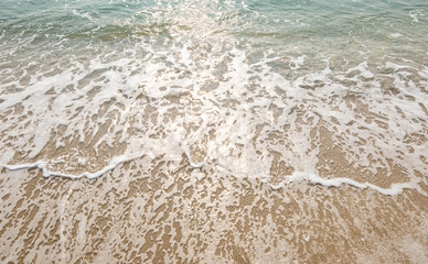 wave of blue ocean on sandy beach. texture Background.