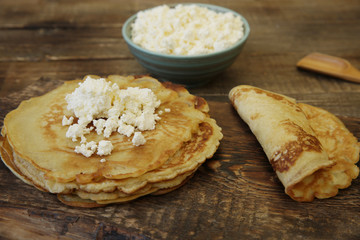close-up pancakes with cottage cheese on wooden rustic background