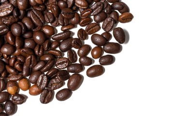 coffee beans sprinkled in half on a white background