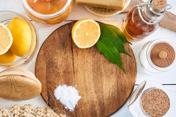 Eco-friendly natural cleaners: baking soda, soap, vinegar, salt, coffee, lemon and brush on a...