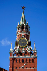 Moscow,  Spasskaya Tower with chimes and a star and a blue sky on Red Square.