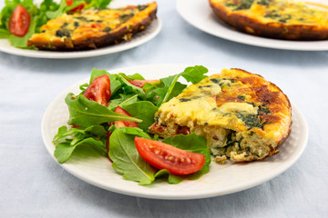 Frittata made of eggs, bacon, cheese and spinach