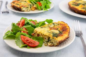 Frittata made of eggs, bacon, cheese and spinach