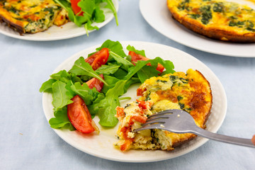 Frittata made of eggs, bacon, cheese and spinach