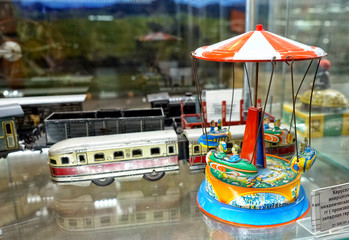 Mechanical carousel. Showcase with old toys in a retro toy store.