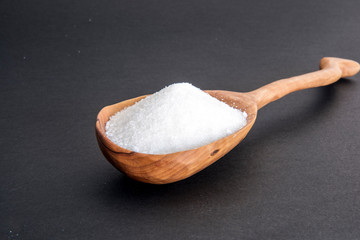 sea salt in wooden spoon