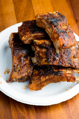 Pork BBQ Ribs. Tradtional Classic barbecue staple. Pork ribs seasoned with a dry rub and slow cooked in a smoker over mesquite wood chips and covered in bbq sauce. 