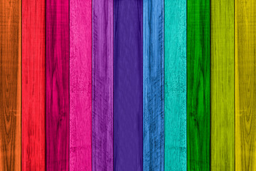 Rainbow colored wood texture background.
