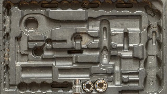 Men tools background. Worker tools and equipment moving close-up. The tool is taken from the case for work, stop motion 4K.