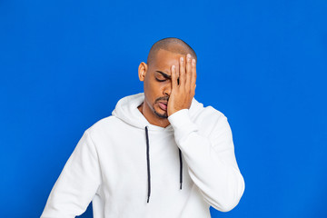 African guy wearing a white sweatshirt