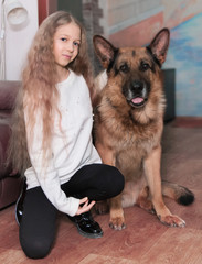 portrait of a teenage girl and her friendly big dog