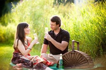 Young Couple Enjoying Picnic Together Outside