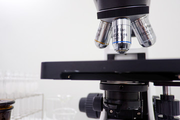 Cropped shot view of  the equipment and science experiments in Laboratory, Chemical substances for research and analyzing a sample under the microscope in laboratory.