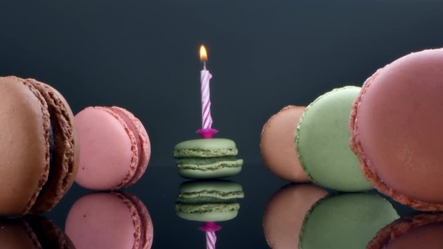 spread macaroons and a burning candle for the holiday