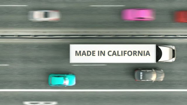 Trailer trucks with MADE IN CALIFORNIA text driving along the highway. Business related loopable 3D animation