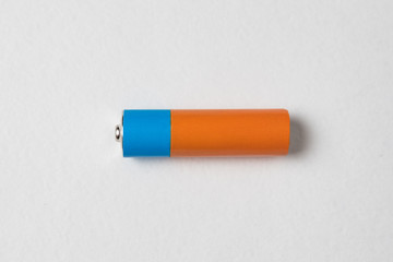 AA alkaline battery on white background. Copy space