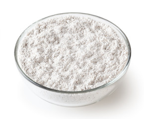Rye flour in glass bowl isolated on white background with clipping path