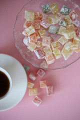 small colorful Turkish delight on pink background