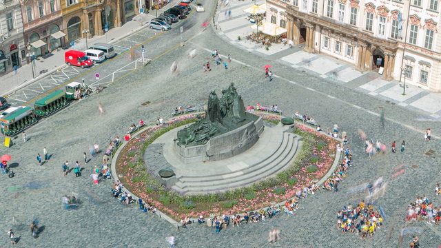 Aerial view of Old Town Square and Jan Hus monument timelapse. People sitting and walking around in Prague, Czech Republic