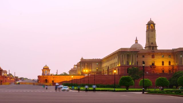 Delhi, India. Illuminated Rashtrapati Bhavan an Parliament building in Delhi, India. Time-lapse of car traffic trail lights. Panning video