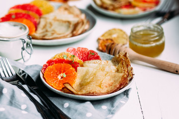 pancakes with citrus on a plate