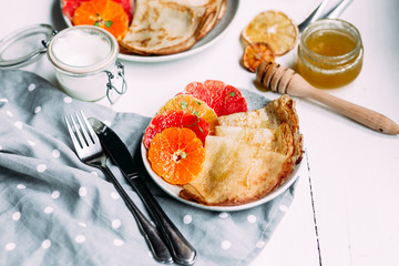 pancakes with citrus on a plate