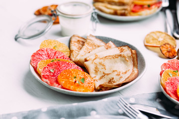 pancakes with citrus on a plate