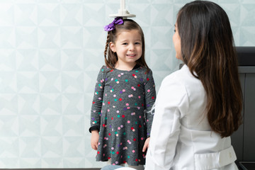 Girl Visiting Pediatrician For Medical Checkup