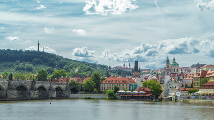 Vltava river embankment timelapse in a sunny summer day. Prague, Czech Republic.