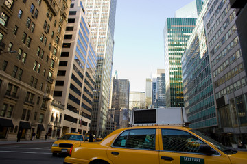 Fototapeta na wymiar Yellow cabs on Park Avenue in midtown Manhattan, New York City, Unites States